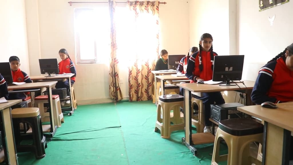 Students at computers in the computer lab
